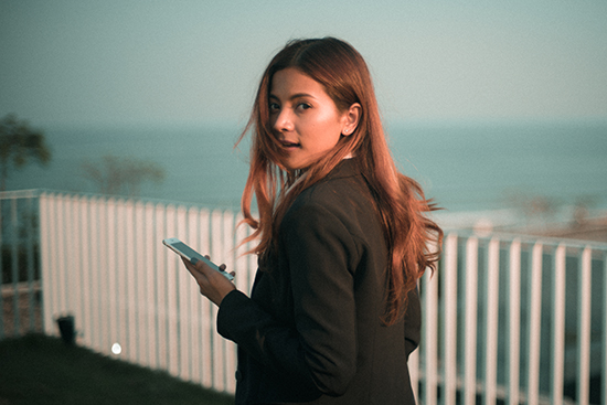 pexels-woman_ cellphone Woman cell phone Virtual office plans